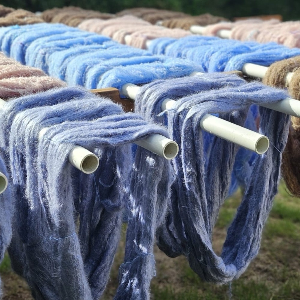 Mohair yarn drying outside workshop.