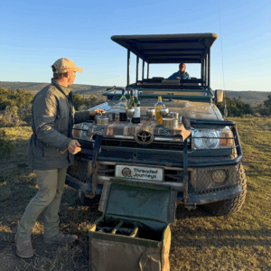 Sundowner in the bush while on safari drive.
