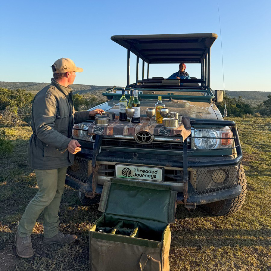 Sundowner in the bush while on safari drive.